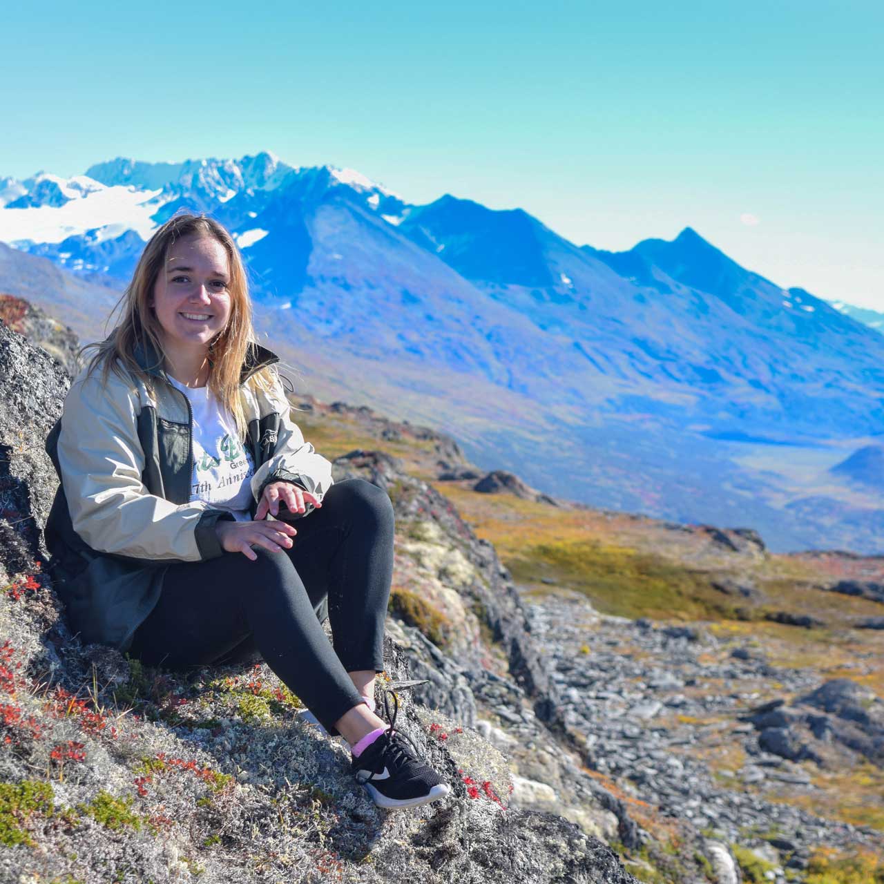 PWSC student sitting at Thompson Pass, Alaska